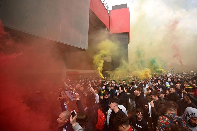 Supporters protest against Manchester United's owners at Old Trafford. AFP