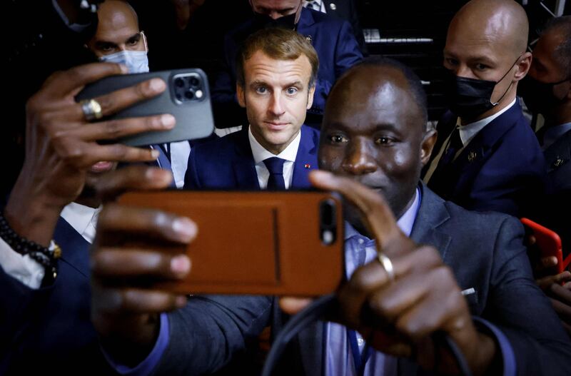 French President Emmanuel Macron poses for a selfie after a basket-ball game during an Africa-France 2021 Summit in Montpellier, southern France. AFP
