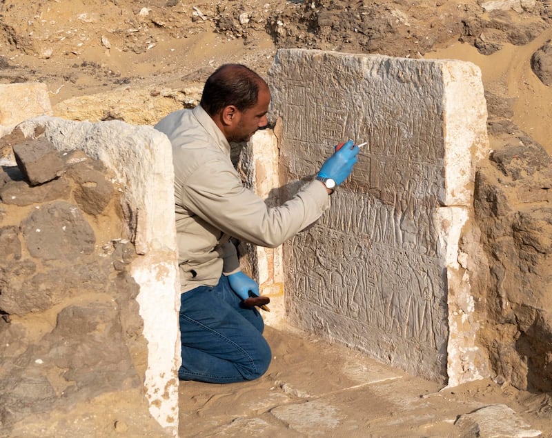 Egyptian conservator Hassan Soliman, who works for the Supreme Council of Antiquities in the Saqqara archaeological area, works to restore the fragile limestone in the small funerary chapel of Yuyu. Photo: Ministry of Tourism and Antiquities Facebook
