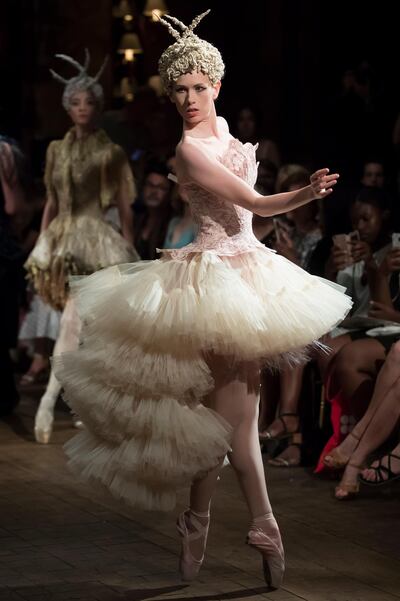 epa06863328 A model displays a creation from the Fall/Winter 2018/19 Haute Couture collection by French designer Franck Sorbier during the Paris Fashion Week, in Paris, France, 04 July 2018. The presentation of the Haute Couture collections runs from 01 to 05 July.  EPA/IAN LANGSDON