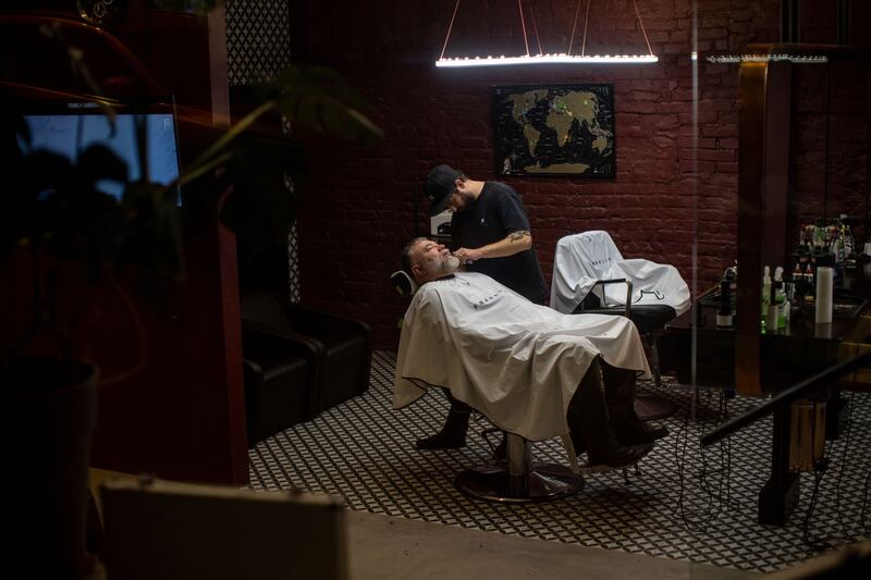 A customer in a barber shop in Kiev. Bloomberg