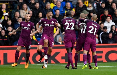 epa06208698 Manchester City's Sergio Aguero  (2-L) celebrates after scoring against Watford during their Premier League match at Vicarage Road Stadium Watford, Britain, 16 September 2017.  EPA/WILL OLIVER EDITORIAL USE ONLY. No use with unauthorized audio, video, data, fixture lists, club/league logos or 'live' services. Online in-match use limited to 75 images, no video emulation. No use in betting, games or single club/league/player publications.