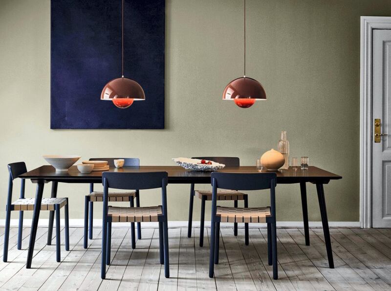 Pendants over the dining table help segregate the space. Courtesy Design Shanghai