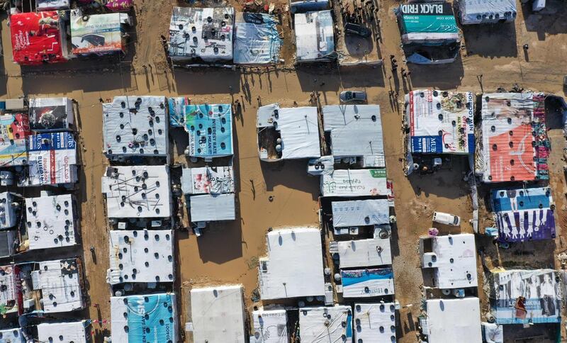 An aerial view shows a tent settlement housing Syrian refugees in Delhamiyeh, in the central Bekaa Valley. Lebanon. AFP