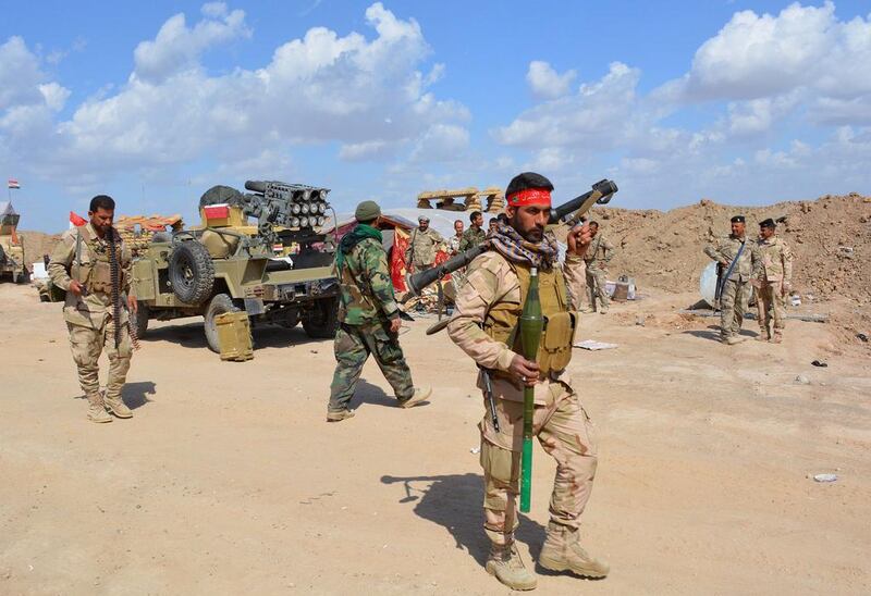 Iraqi government forces and allied militias take position in the northern part of Diyala province, bordering Salaheddin province, as they take part in an assault to retake the city of Tikrit from ISIL militants  on March 2, 2015. Younis Al Bayati / AFP