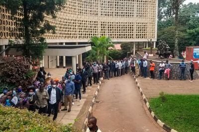 Voters queue to vote at a polling station in Kampala, Uganda, on January 14, 2021. Ugandans began voting in a tense election on January 14, 2021 under heavy security and an internet blackout as veteran leader Yoweri Museveni pursues a sixth term against a former pop star half his age.
The internet went down on the eve of the vote, with some parts of the country reporting complete disruptions or significant slowdowns, after one of the most violent election campaigns in years.
 / AFP / -
