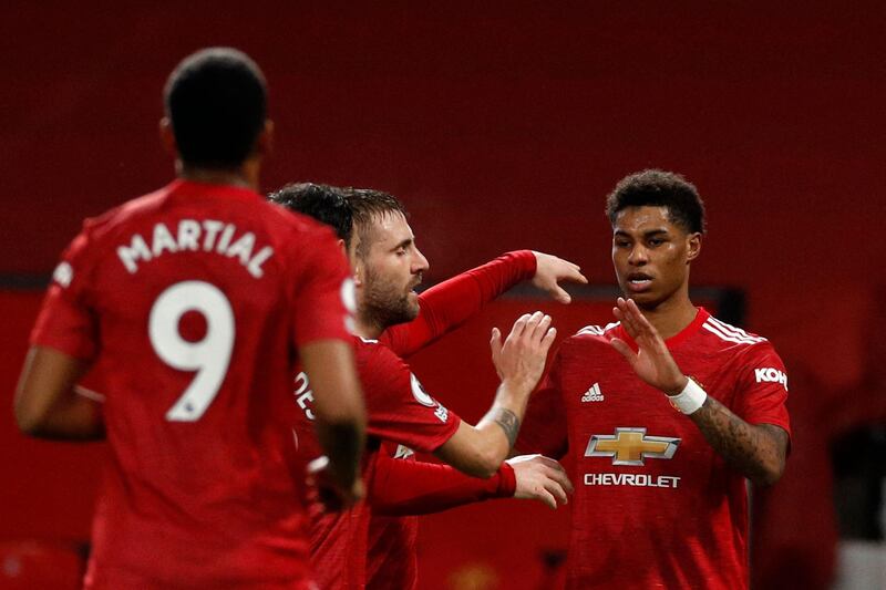 Manchester United striker Marcus Rashford (R) celebrates scoring the opening goal during their 3-1 win in Newcastle's last Premier League match. AFP
