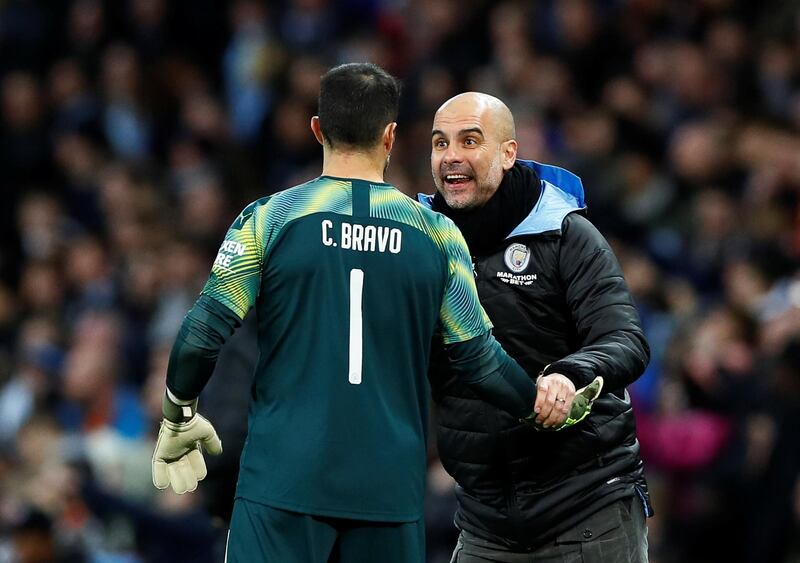 Manchester City manager Pep Guardiola with Claudio Bravo Action. Reuters