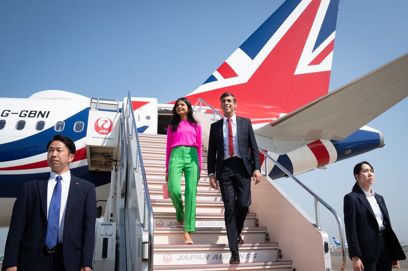 Akshata Murty wears a pop of colour as she arrives at Tokyo Airport with her husband, UK Prime Minister Rishi Sunak, ahead of the G7 Summit in May. Getty Images