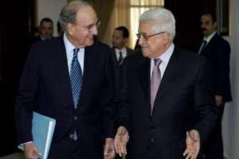 Palestinian President Mahmoud Abbas (R) walks with U.S. Middle East Envoy George Mitchell during their meeting in the West Bank city of Ramallah January 22, 2010, in this picture released by the Palestinian Press Office (PPO). Israel and the Palestinians belittled each other's commitment to peace as U.S. President Barack Obama admitted on Thursday he had underrated the difficulty of reviving deadlocked Middle East negotiations.  REUTERS/Omar Rashidi/PPO/Handout (WEST BANK - Tags: POLITICS) FOR EDITORIAL USE ONLY. NOT FOR SALE FOR MARKETING OR ADVERTISING CAMPAIGNS *** Local Caption ***  JER06_ISRAEL-PALEST_0122_11.JPG