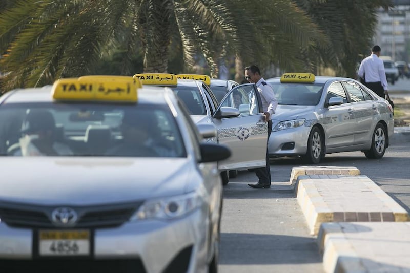 Some taxi drivers have to meet a daily fare target of Dh550 to qualify for commissions. Mona Al Marzooqi / The National