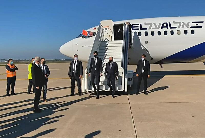 A screen grab from a handout video released by the US embassy in Morocco shows US President's advisor Jared Kushner (L) and Israeli National Security Advisor Meir Ben Shabbat leaving the plane upon landing, in Moroco's capital Rabat,  on the first Israel-Morocco direct commercial flight, marking the latest US-brokered diplomatic normalisation deal between the Jewish state and an Arab country. AFP