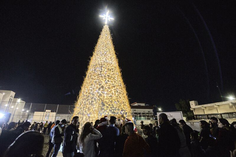 A crowd gathers at the Qaraqosh Christmas tree. AFP
