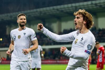 epaselect epa07456964 France player Antoine Griezmann (R) celebrates after scoring against Moldova during the UEFA EURO 2020 qualifying matches group H soccer match between Moldova and France in Chisinau, Moldova, 22 March 2019.  EPA/DUMITRU DORU