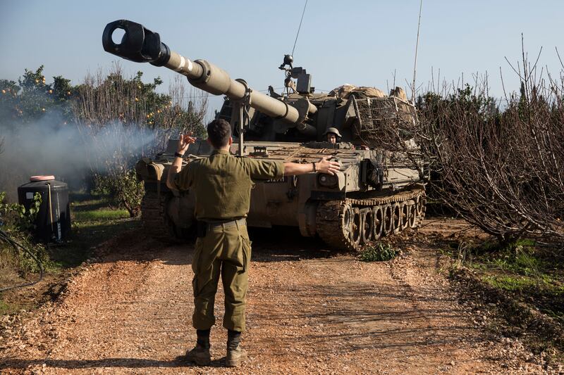 An Israeli soldier directs an artillery unit near the border with Lebanon in Israel. The war between Israel and Hamas has also inflamed tensions on the country's northern border with Lebanon. Getty Images