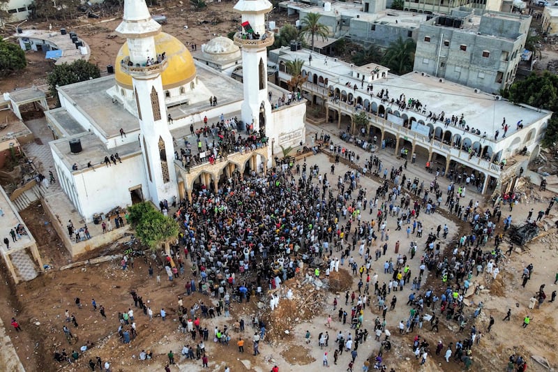 People gather for a demonstration outside the surviving Al Sahaba mosque. AFP