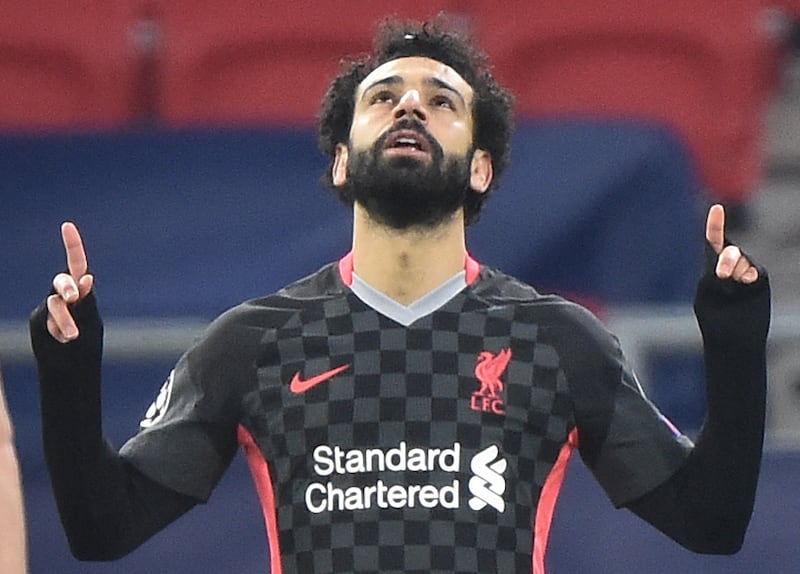 Liverpool star Mohamed Salah celebrates scoring the opening goal against Leipzig. AFP