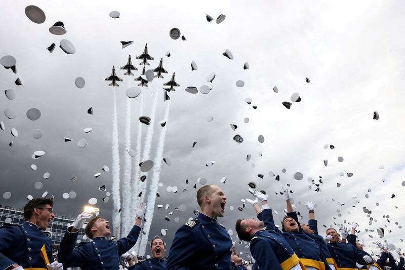 U. S.  Air Force jets fly overhead as USAF Academy cadets celebrate during their graduation ceremony attended by President Joe Biden at Falcon Stadium in Colorado Springs, Colorado, U. S. , June 1, 2023.   REUTERS / Kevin Mohatt     TPX IMAGES OF THE DAY