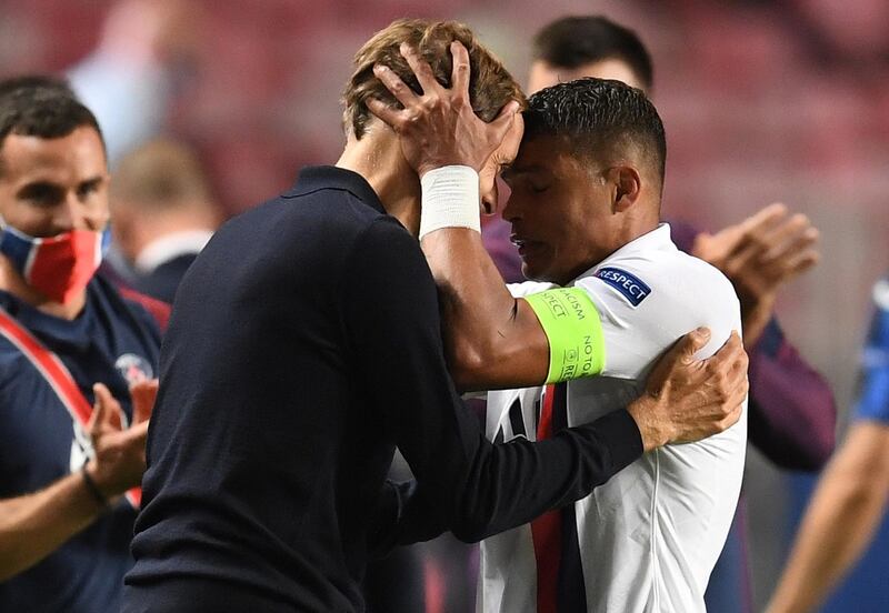 PSG head coach Thomas Tuchel (L) celebrates with captain Thiago Silva. EPA