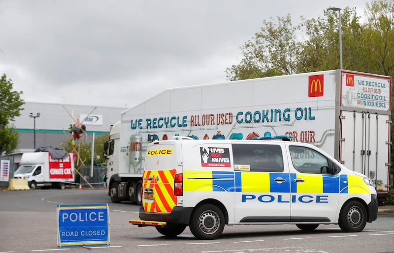 A police car is seen outside a McDonald's distribution site during an action by Animal Rebellion protesters, in Hemel Hempstead, Hertfordshire, Britain, May 22, 2021. REUTERS/Matthew Childs
