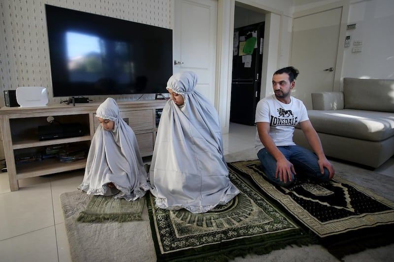 Jamil Kaydee, Niina Kaydee and daughter Amelia during afternoon asr prayer at their home in Sydney, Australia. Niina Kaydee believes this Ramadan to be the most peaceful and calm one that she's ever experienced. Getty Images