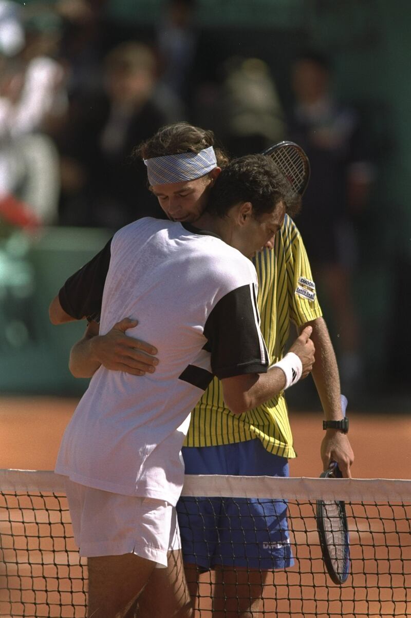 8 Jun 1997:  Gustavo Kuerten of Brazil embraces Sergi Bruguera of Spain after Kuerton's win in the French Open at Roland Garros Stadium in Paris, France.  \ Mandatory Credit: Mike Hewitt /Allsport