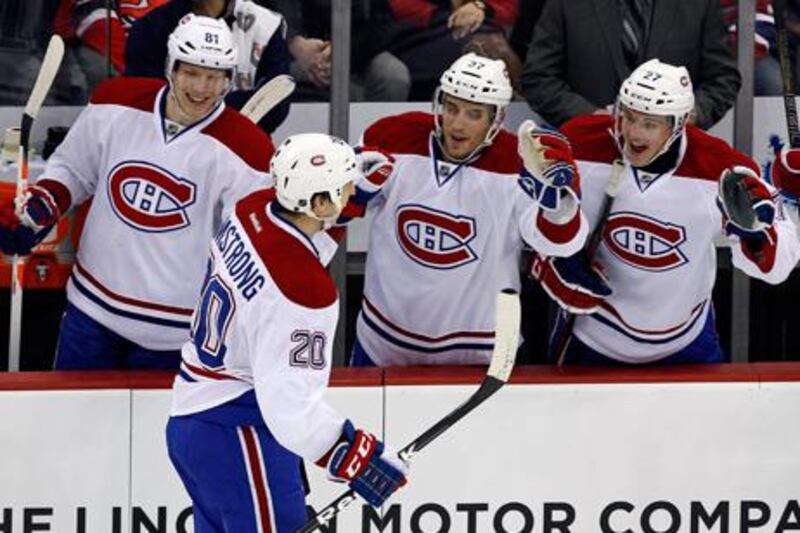 Montreal Canadiens winger Colby Armstrong is congratulated by teammates after scoring against New Jersey.