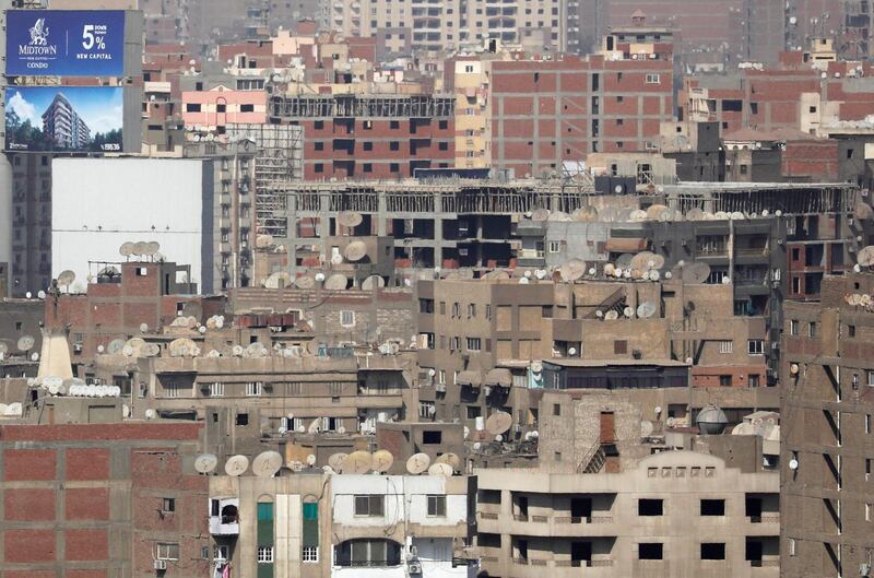 Housing near a billboard advertising new houses in Cairo, Egypt. Reuters