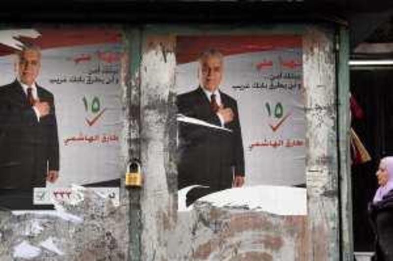 Posters of Vice President Tariq al-Hashimi, a candidate for the Iraq parliamentary elections are seen at a street in the Syrian capital of Damascus February 27, 2010. REUTERS/Khaled al-Hariri (SYRIA - Tags: POLITICS ELECTIONS)