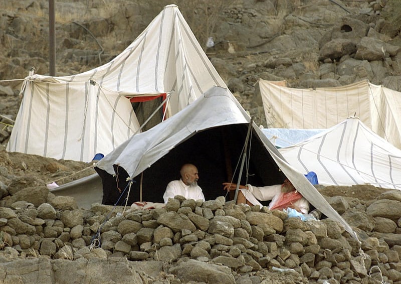 Pilgrims rest inside their tents erected on a mountaintop in Mina on the first day of the Eid Al Adha in March 2000. AFP