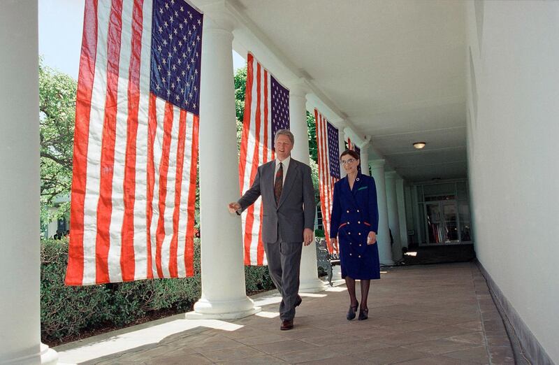 President Bill Clinton and Ruth Bader Ginsburg walk along the Colonnade of the White House in Washington, as they head to the Rose Garden for a news conference where the resident nominated Ginsburg to fill the vacancy on the Supreme Court. AP Photo
