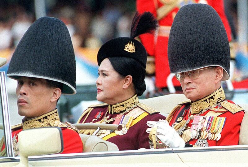 Thailand's King Bhumibol and Queen Sirikit and Crown Prince Maha Vajiralongkorn review troops in Bangkok in 200.  AFP