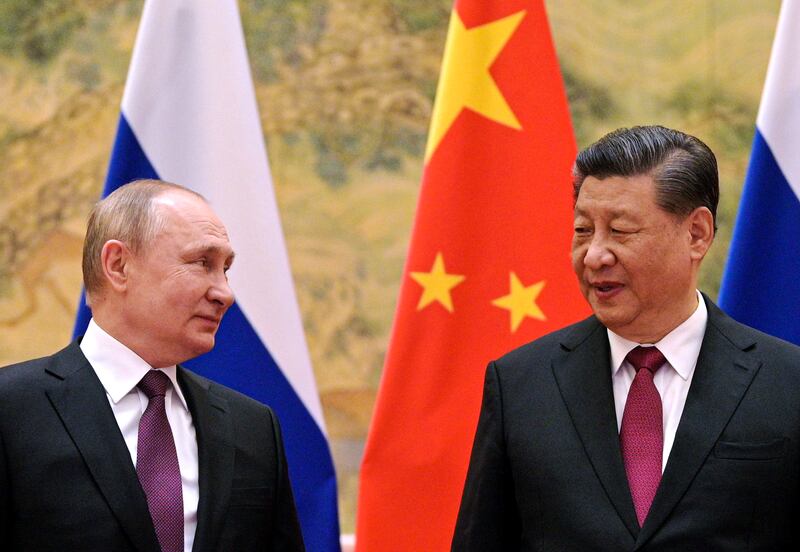 Chinese President Xi Jinping, right, and Russian President Vladimir Putin meet in Beijing on February 4 last year. China's diplomacy is becoming more visible, growing in tandem with its economic influence. AP