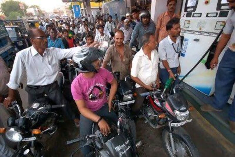 Indian motorcyclists queued at petrol pumps to fill their bikes after an announcement in May of a 7.50-rupee a litre price hike in fuel.