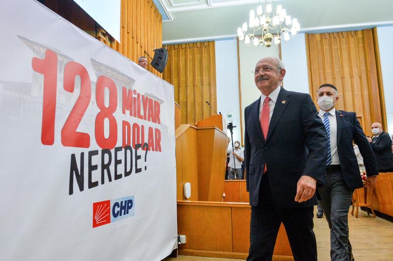 Leader of main the opposition Republican People's Party (CHP) Kemal Kilicdaroglu walks by a banner that reads: "Where is the $128 billion?" during a party meeting at the Turkish Parliament in Ankara, Turkey April 13, 2021. Picture taken April 13, 2021. Republican People's Party/Handout via REUTERS ATTENTION EDITORS - THIS PICTURE WAS PROVIDED BY A THIRD PARTY. NO RESALES. NO ARCHIVE.