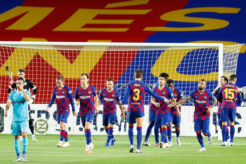 Barcelona's Antoine Griezmann, third left, after scoring his side's second goal before it was disallowed by VAR. AP Photo
