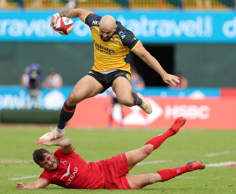 Dubai, United Arab Emirates - December 07, 2019:  Tim Richards of Hurricanes beats the defence of Bahrain during the game between Dubai Hurricanes vs Bahrain in the Gulf mens final in the HSBC rugby sevens series 2020. Saturday, December 7th, 2019. The Sevens, Dubai. Chris Whiteoak / The National