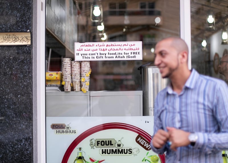 DUBAI, UNITED ARAB EMIRATES. 29 JULY 2019. 
Foul w Hummus restaurant in Barsha has placed a sign saying “If you can’t buy this food, it’s free, this is a gift from Allah”

(Photo: Reem Mohammed/The National)

Reporter:
Section: