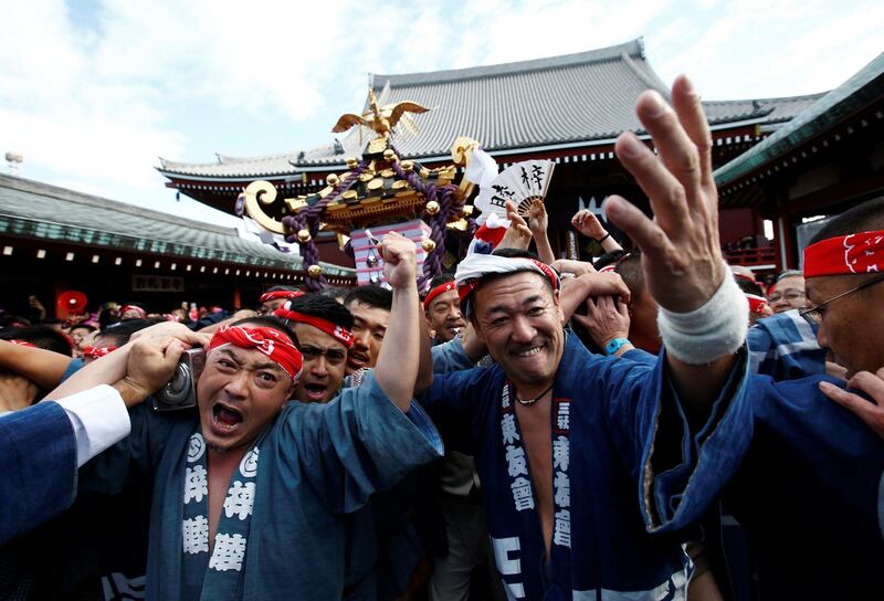 People carry a portable shrine, a Mikoshi, at the Senso-ji Temple during the Sanja festival in Asakusa district in Tokyo, Japan. Kim Kyung-Hoon / Reuters