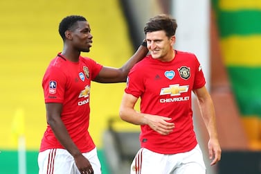 Manchester United's Harry Maguire (right) celebrates victory with Paul Pogba after the FA Cup quarter final match at Carrow Road, Norwich. PA Photo. Issue date: Saturday June 27, 2020. See PA story SOCCER Norwich. Photo credit should read: Catherine Ivill/NMC Pool/PA Wire. RESTRICTIONS: EDITORIAL USE ONLY No use with unauthorised audio, video, data, fixture lists, club/league logos or "live" services. Online in-match use limited to 120 images, no video emulation. No use in betting, games or single club/league/player publications.