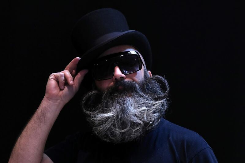 A participant of the international World Beard and Moustache Championships poses before taking part in one of the 17 categories of beard and moustache styles competing in Antwerp, Belgium. Reuters