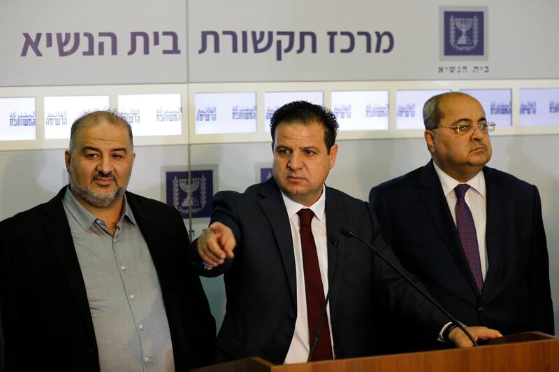 Members of the Joint List Ayman Odeh, center, speaks to the press in the presence of Ahmad Tibi, right, and Mansour Abbas following their consulting meeting with Israeli President Reuven Rivlin, in Jerusalem, Sunday, Sept. 22, 2019. Rivlin began two days of crucial talks Sunday with party leaders before selecting his candidate for prime minister, after a deadlocked repeat election was set to make forming any new government a daunting task. (Menahem Kahana/Pool via AP)