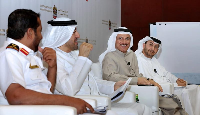 UAE economy minister Sultan Al Mansouri, second from right, predicted in January last year that the UAE’s economy would grow by 4.5 per cent, before revising his estimate to 3.5 per cent in October. Courtesy Ministry of Economy