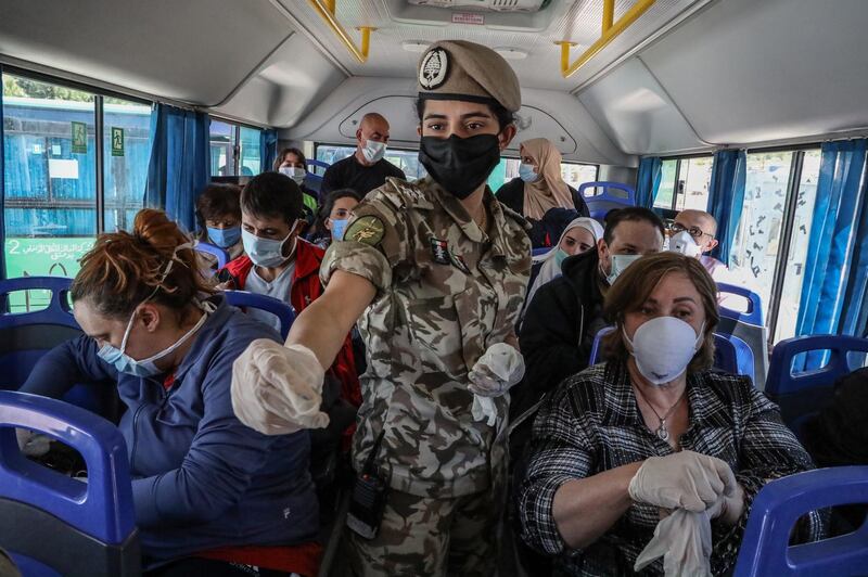 American citizens who were stranded abroad arrive at the Lebanese border coming from Syria on their way to Beirut airport to return to the US on a US cargo plane. EPA