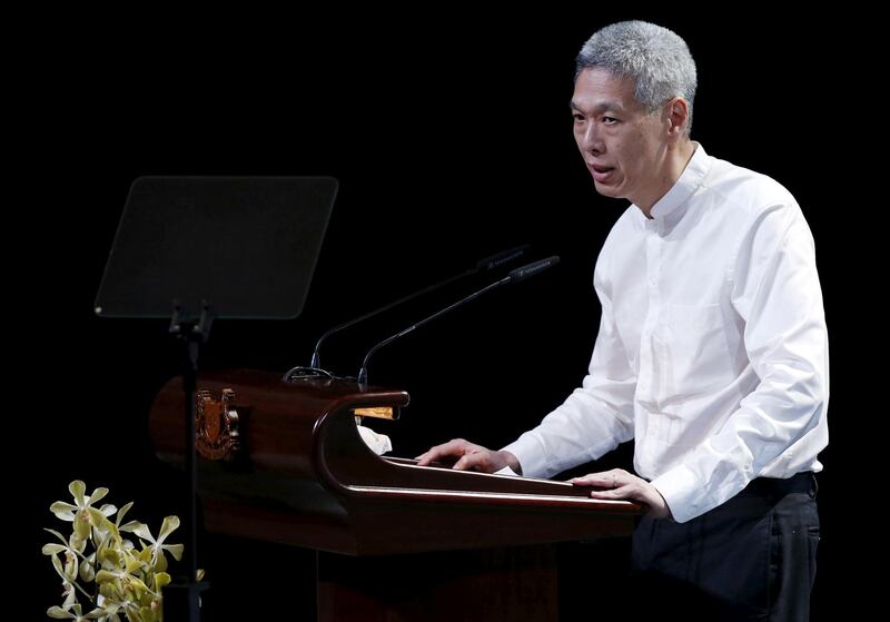 FILE PHOTO: Lee Hsien Yang, son of former leader Lee Kuan Yew, delivers his eulogy during the funeral service at the University Cultural Centre at the National University of Singapore March 29, 2015.    REUTERS/Edgar Su/File Photo