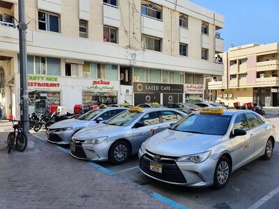 taxis parked outside Pinky Food Restaurant in Abu Dhabi.. Rob McKenzie for The National
