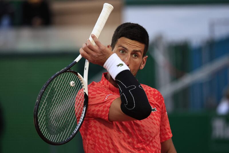 Novak Djokovic with strapping on his elbow during his defeat against Lorenzo Musetti at the Monte-Carlo Masters on April 13, 2023. AFP