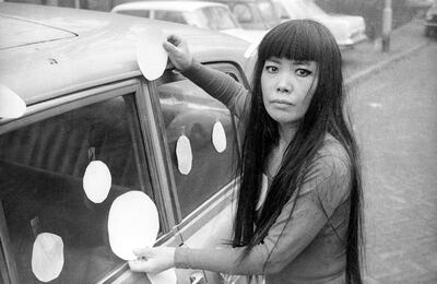 Artist Yayoi Kusama next to her “Dot Car”(1965). Photo credit: Harrie Verstappen