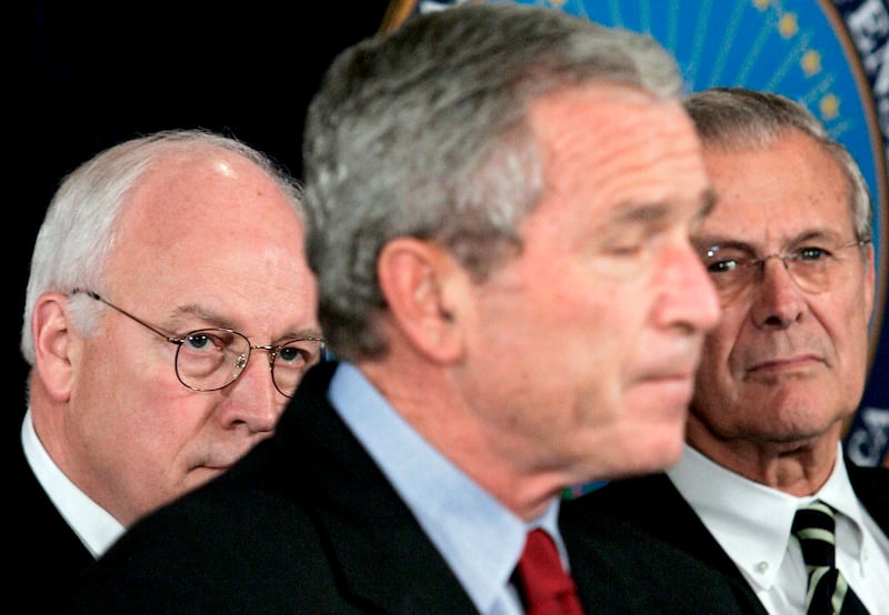 George W. Bush speaks about the war on terror as Dick Cheney, left, and Donald Rumsfeld look on at the Pentagon in September 2005. EPA