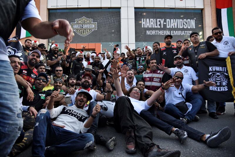 Various biker groups pose for a photograph outside the Harley Davidson showroom during the 48th National Rally "Love Zayed" in Sharjah, UAE, Friday, Nov. 29, 2019. Shruti Jain The National